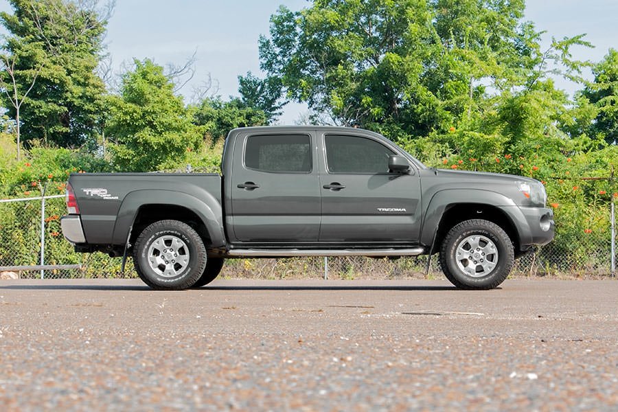 Fits Toyota Tacoma 2WD/4WD (2005-2023) 2 Inch Leveling Kit; Aluminum; Red 744RED