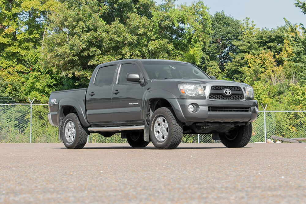 Fits Toyota Tacoma 2WD/4WD (2005-2023) 2 Inch Leveling Kit; Aluminum; Red 744RED